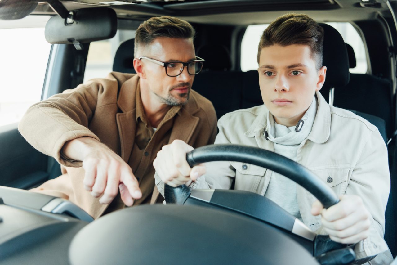 Dad teaching teen how to drive